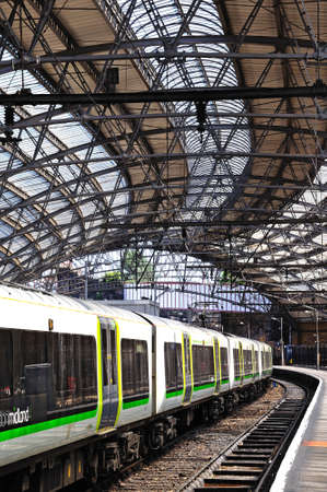 London Midland Class 350 train alongside platform in Lime Street Railway Station, Liverpool,...
