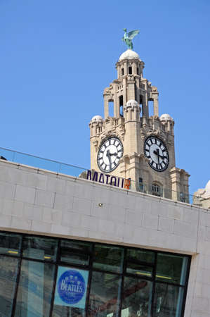 The Beatles Story in the Ferry Building at Pier Head with the Liver Building clock tower and Liver...