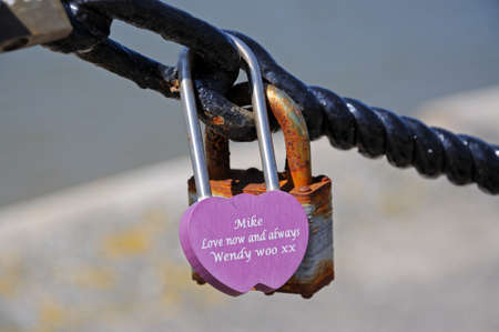 Pink lovelock attached to the railings along the waterfront, Liverpool, Merseyside, England, UK, Western Europe.のeditorial素材