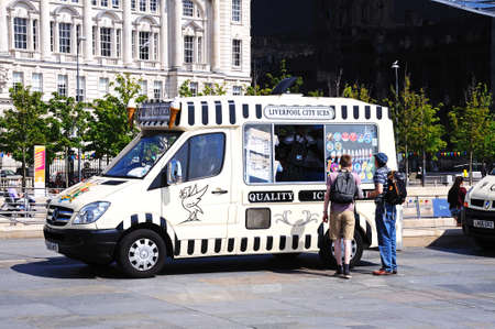 People buying ice cream from an ice cream van by the quayside, Liverpool, Merseyside, England, UK, Western Europe.のeditorial素材