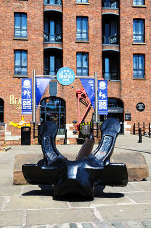 The Beatles Story exhibition building at Albert Dock with a large anchor in the foreground, Liverpool, Merseyside, England, UK, Western Europe.のeditorial素材