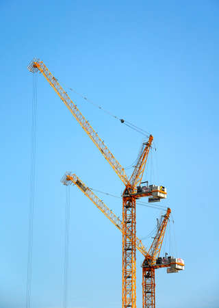 Construction cranes against a blue sky, Liverpool, Merseyside, England, UK, Western Europe.のeditorial素材