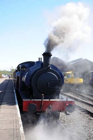 Hunslett Saddle Tank Loco steam train about to begin journey alongside the platform, Brownhills West Railway Station, Chasewater, West Midlands, England, UK, Western Europe.のeditorial素材