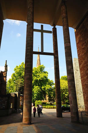 Holy Trinity Church spire seen through the new Cathedral entrance, Coventry, West Midlands, England, UK, Western Europe.のeditorial素材