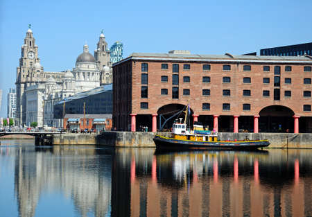 Yachts moored in Albert Dock with the Three Graces to the rear, Liverpool, Merseyside, England, UK, Western Europe.のeditorial素材