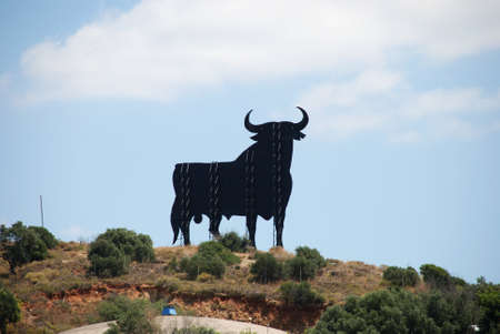 Silhouette of a bull on the hillside, Fuengirola, Malaga Province, Andalusia, Spain, Western Europe.の写真素材
