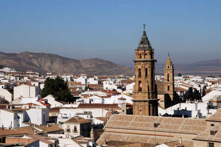 San Sebastian nearest and San Augustin church towers with views over city rooftops, Antequera, Malaga Province, Andalucia, Spain, Western Europe.の写真素材
