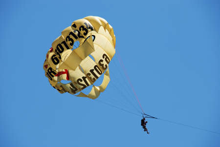 Two people parasailing against a blue sky, Fuengirola, Malaga Province, Andalusia, Spain, Western Europe.のeditorial素材
