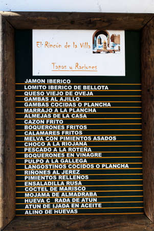 Restaurant tapas menu showing various dishes, Conil de la Frontera, Costa de la Luz, Cadiz Province, Andalusia, Spain, Western Europe.のeditorial素材