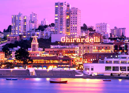 Ghirardelli shopping centre at dusk seen from across harbour, San Francisco, California, USA.のeditorial素材