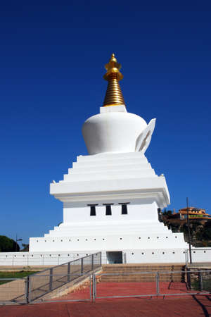View of the Stupa which is a dome shaped building erected as a Buddhist shrine in Benalmadena Puebo, Benalmadena, Costa del Sol, Malaga Province, Andalusia, Spain, Western Europe.のeditorial素材