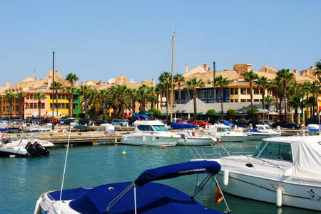 Yachts and boats in the marina with buildings to the rear, Puerto Sotogrande, Cadiz Province, Andalucia, Spain, Western Europe.のeditorial素材
