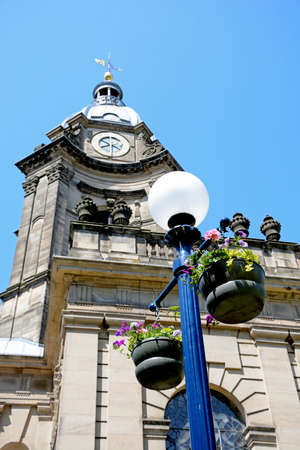 View of St Philips Cathedral and bell tower with a streetlight with hanging baskets in the foreground, Birmingham, England, UK, Western Europe.の写真素材