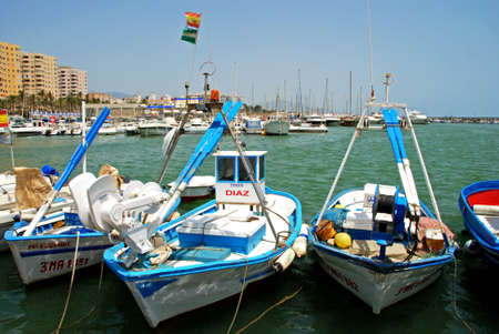 Traditional fishing boats in the harbour with yachts and the marina to the rear, Estepona, Malaga Province, Andalusia, Spain, Western Europe.のeditorial素材