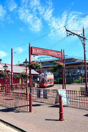View of a Seaton Electric Tramway Tram seen through the wrought iron Electric Tramway entrance arch,...