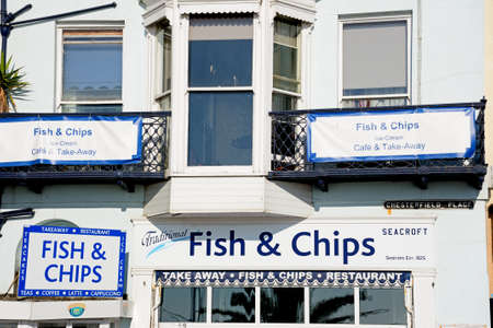 Traditional fish and chips shop signs along the Esplanade, Weymouth, Dorset, England, UK, Western Europe.のeditorial素材