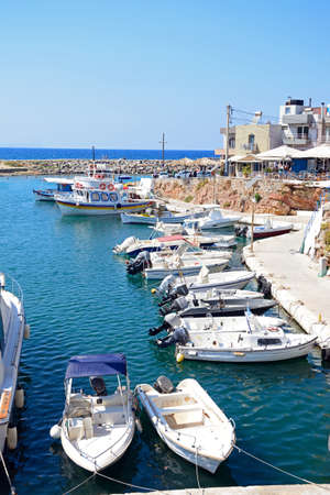 Elevated view of boats moored in the harbour, Sissi, Crete, Greece, Europe.のeditorial素材