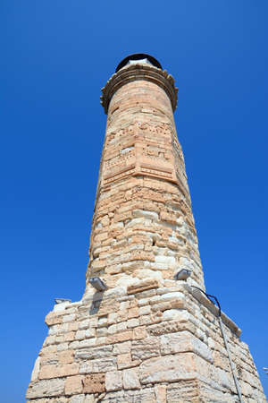 View of the lighthouse at the entrance to the harbour, Rethymno, Crete, Greece, Europe.の写真素材
