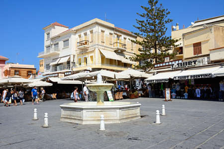 Fountain in the Pl El Venizelou square with tourists enjoying the sights, Chania, Crete, Greece,...