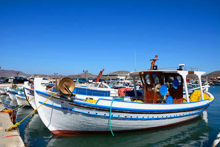 Traditional fishing boats in the harbour, Elounda, Crete, Greece, Europe.のeditorial素材
