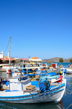 Traditional fishing boats in the harbour, Elounda, Crete, Greece, Europe.