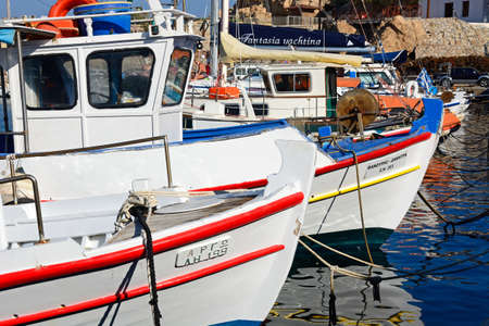 Greek fishing boats moored in the harbour, Hersonissos, Crete, Greece, Europe.のeditorial素材