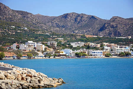 View across the sea towards the beach and town, Makrigialos, Crete, Greece, Europe.のeditorial素材