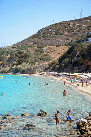 Tourists relaxing on the beach, Istro, Crete, Greece, Europe.のeditorial素材