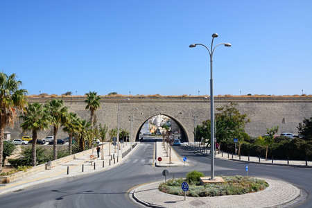 Arch in the city defence wall with a traffic island in the foreground, Heraklion, Crete, Greece, Europe.のeditorial素材