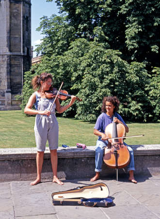 Young classical street musicians along Kings Parade, Cambridge; Cambridgeshire, England, UK, Western Europe.のeditorial素材