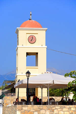 Pavement cafe with the church tower to the rear, Ierapetra, Crete, Greece, Europe.のeditorial素材