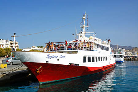 People on a tour boat moored in the harbour, Ierapetra, Crete, Greece, Europe.