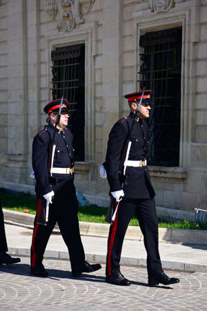 Military parade after the arrival of political dignitaries for the EPP European Peoples party congress outside the Auberge de Castille (office of the Prime Minister) in Castille Square, Valletta, Malta, Europe.のeditorial素材