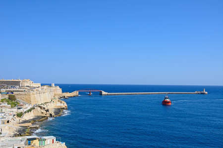 Elevated view of city buildings on the East side of the grand harbour with the bridge and fort to the rear, Valletta, Malta, Europe.のeditorial素材