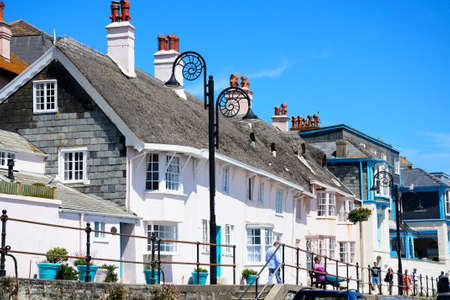 Buildings along the promenade with ammonite decorated streetlights, Lyme Regis, Dorset, England, UK, Western Europe.のeditorial素材