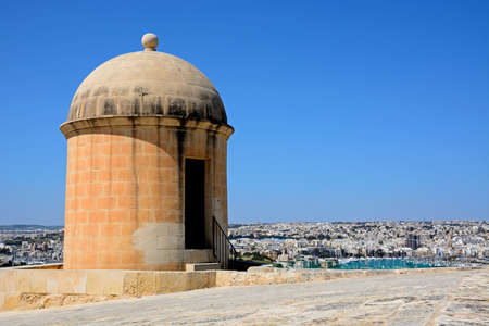 View of St Michaels Bastion with Manoel Island and Sliema to the rear, Valletta, Malta, Europe.の写真素材