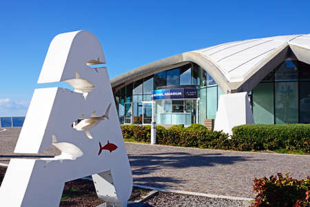 View of National Aquarium in St Pauls Bay with a letter A containing fish sign in the foreground, Bugibba, Malta, Europe.のeditorial素材