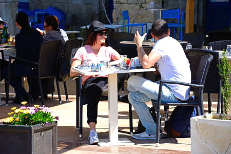 Couple relaxing at a pavement cafe along the waterfront, Vittoriosa (Birgu), Malta, Europe.のeditorial素材