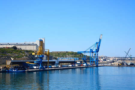 View of the docks with buildings to the rear, Paola, Malta, Europe.のeditorial素材