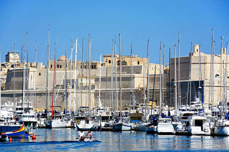 View of Senglea and Vittoriosa marina and waterfront buildings with views towards Fort St Angelo, Vittoriosa (Birgu), Malta, Europe.のeditorial素材
