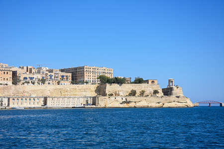 Valletta waterfront buildings seen from across the Grand Harbour in Vittoriosa, Valletta, Malta, Europe.のeditorial素材