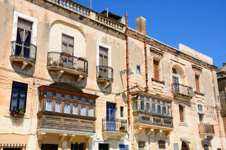 Buildings with interesting balconies and windows, Vittoriosa (Birgu), Malta, Europe.のeditorial素材