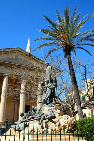 St Pauls Anglican Pro-Cathedral with a Dun Mikiel Xerri statue in the foreground, Valletta, Malta, Europe.のeditorial素材