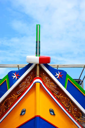 The bow of a brightly painted traditional Dghajsa boat, Bugibba, Malta, Europe.の写真素材