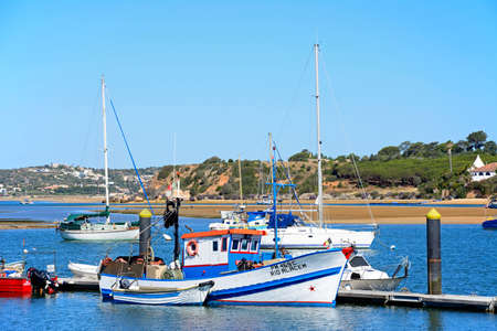 Fishing boats and yachts moored in the estuary, Alvor, Algarve, Portugal, Europe.のeditorial素材