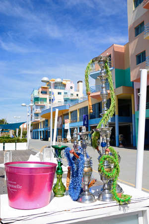 Hookah pipes at a waterfront restaurant in the marina with buildings to the rear, Albufeira,...