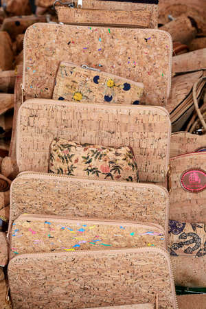 Portuguese cork purses on a market stall, Lagos, Algarve, Portugal, Europe.