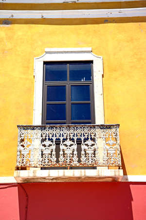 Traditional Portuguese building with a wrought iron balcony in the old town, Portimao, Algarve, Portugal, Europe.の写真素材