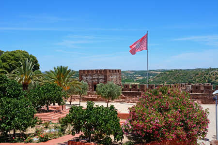 Medieval battlements and towers inside the castle with views across the countryside, Silves, Portugal, Europe.のeditorial素材