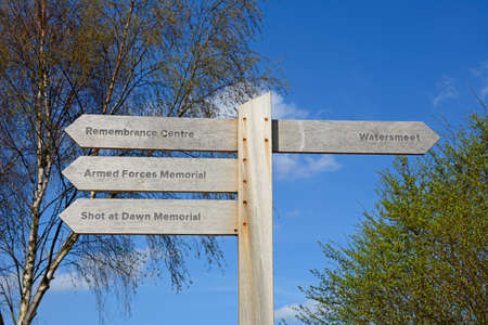 Wooden memorials fingerpost sign at the National Memorial Arboretum, Alrewas, Staffordshire, England, UK, Western Europe.のeditorial素材